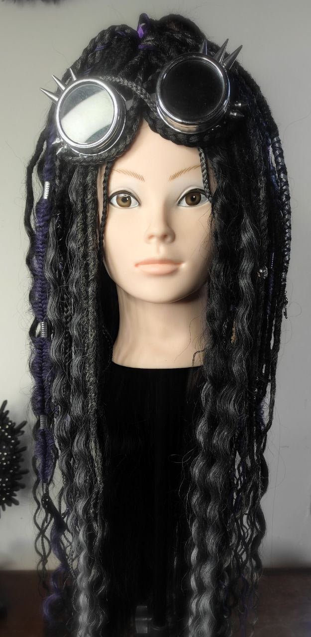 a mannequin head with dreadlocks and gothic curls