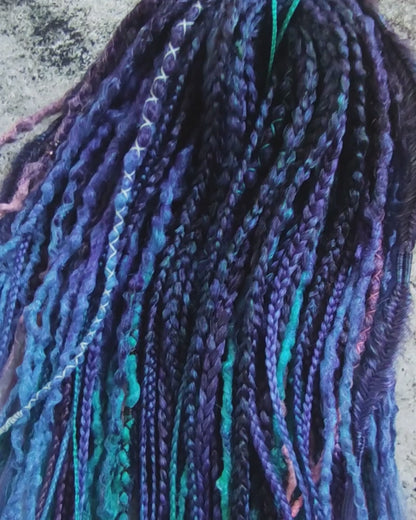 Purple synthetic dreads featuring brown-to-pink, turquoise, and blue ombre extensions, along with braids - Video