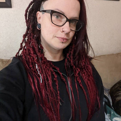 white girl with Burgundy (red) synthetic dreads making selfie