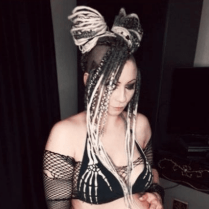 Goth girl with Black and White Dreadlocks. Bra with skeleton arms